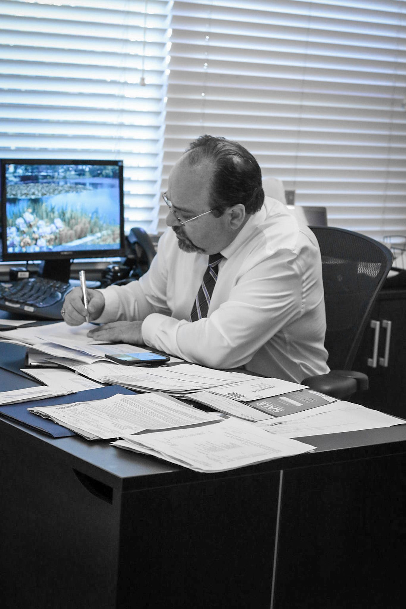 Robert Tavelli working at his desk.